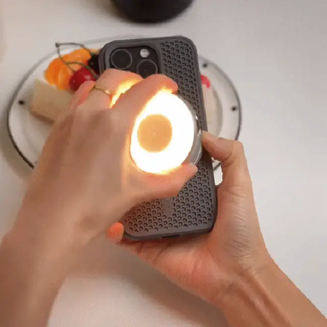 Woman using magnetic selfie light