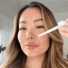 Woman applying Rice Peel Shot Duo to her face